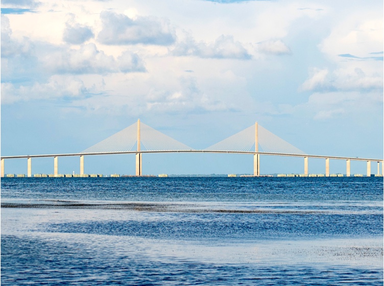 View of a bridge over the ocean in the horizon